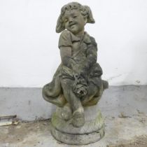 A two-section weathered stone garden sculpture, study of a seated girl on circular plinth base.