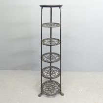 A vintage cast iron six-tier pot rack, with label for The Viking. height 123cm