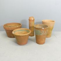 Four various terracotta pots, 33cm, and a chimney pot. (5) One marked Yorkshire flower pots.