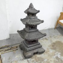 A concrete four-section Japanese pagoda garden ornament. 49x105cm.