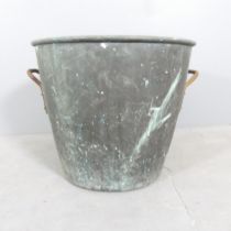 A zinc lined copper log basket. 54x48cm.