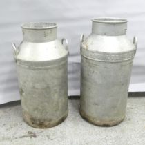 A near pair of galvanised milk churns. Tallest marked Midland Counties, 69cm.