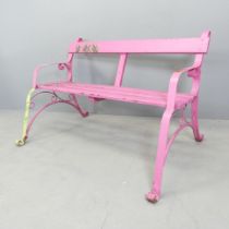 A pink painted Victorian iron strapwork bench. 130x74x78cm. Screw repair to rear of left leg.