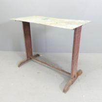 FISCHEL - An early 20th century French industrial work table with cast iron base and maker's