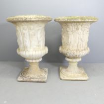 A pair of reconstituted stone two-section Grecian design garden urns on stands. 65x90cm.