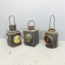 Three vintage railway lanterns, including an Adlake non-sweating lamp, one marked BR(W) and one