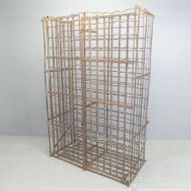 An antique French iron wine cabinet, with two doors and marked "Fer Rigide Bte SGDG".