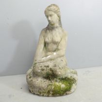 A weathered concrete garden statue, study of nude female figure on plinth. Impressed DB95 to rear.