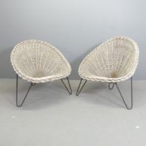 A pair of mid-century style rattan cone chairs designed by Terence Conran.