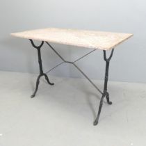 A rectangular marble topped garden table on cast iron base. 100x73x52cm.