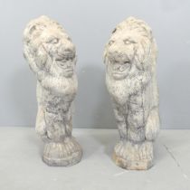 A pair of reconstituted stone Lion garden statues. Height 54cm.