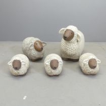 A flock of five glazed ceramic sheep ornaments. Largest 46x36x25cm.