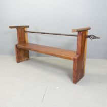 A stained pine bench, by local artist Clive Fredriksson. 180x78x43cm.