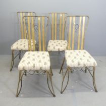 A set of four painted wrought metal garden chairs with upholstered seats.