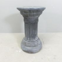 A stone Doric column. 28x48cm.