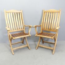 ALEXANDER ROSE - A pair of roble wood Bengal folding carver chairs, with maker's plaques to rear