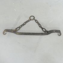 An Eastern cast iron pot carrier. Length 84cm.