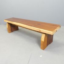 A stained pine bench. 131x33x30cm.