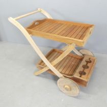 A weathered teak two-tier garden drinks trolley. Overall 90x80x70cm.