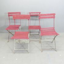 A set of four Parisienne folding bistro café chairs.