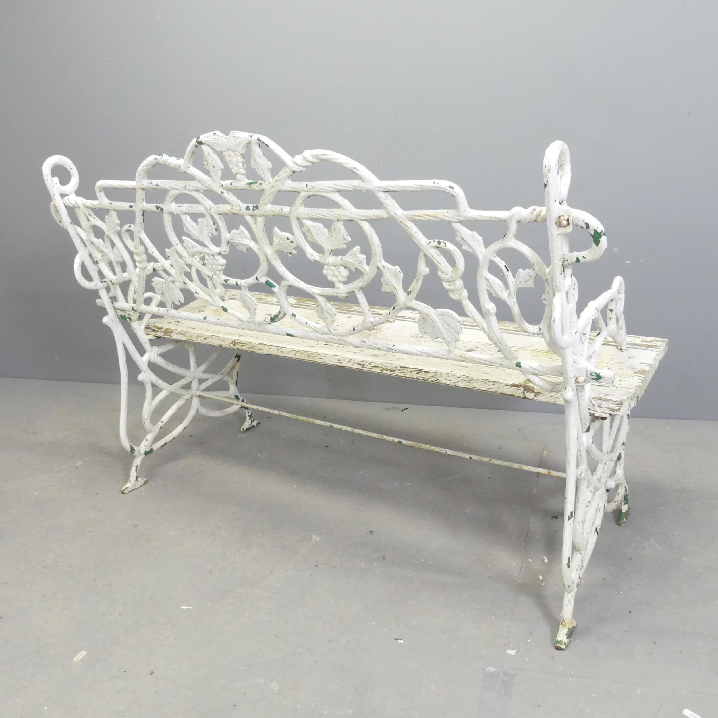 A Victorian painted wrought iron garden bench, with slatted wooden seat. Overall 123x86x55cm, seat - Image 3 of 3