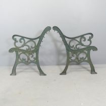 A pair of painted cast iron bench ends. Height 78cm.