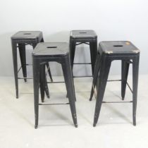 A set of four metal Tolix style stools. Height 77cm.