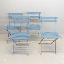 A set of four Parisienne folding bistro café chairs.