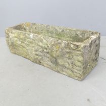 A small weathered concrete garden trough. 63x19x22cm.