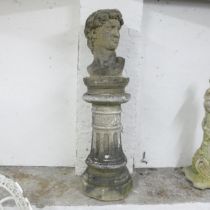 A weathered concrete bust, study of David, on associated fluted pedestal. Height overall 127cm.