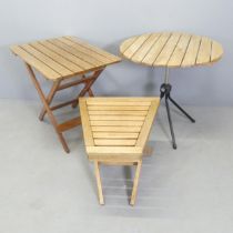 Two teak folding garden tables, and a circular folding table on tubular metal stand. (3). Circular