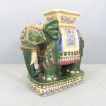 A painted ceramic elephant design garden seat. 58x59x28cm. Good overall condition, some rubbing to