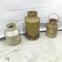 Three various milk churns. Tallest 67cm. Markings too rusted to identify.