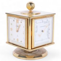 Neiman-Marcus, a mid-century gilt desk clock and weather compendium, on revolving stand, Swiss-