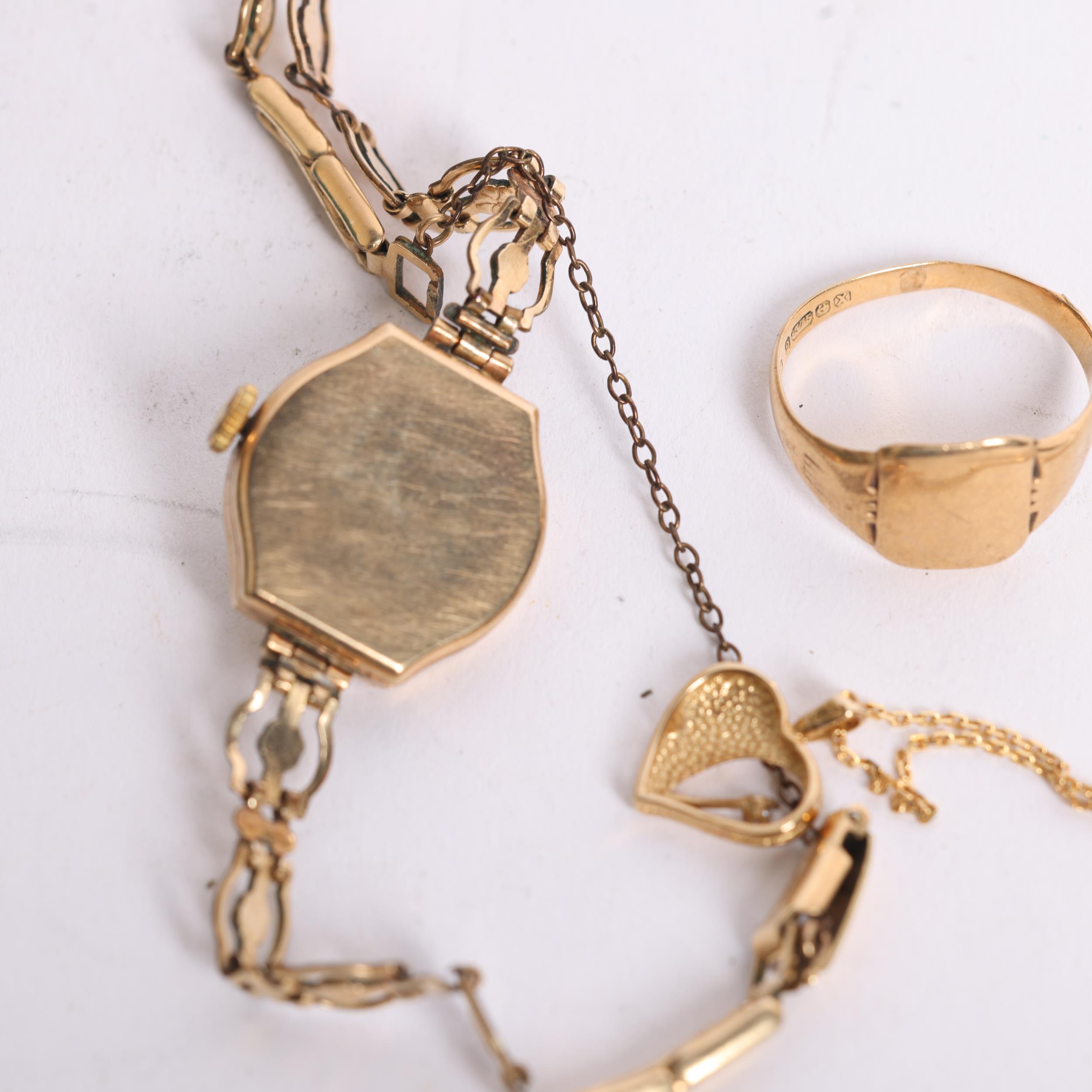 A group of gold jewellery, including a 9ct gent's signet ring, and a 9ct gold chain with heart - Image 2 of 2