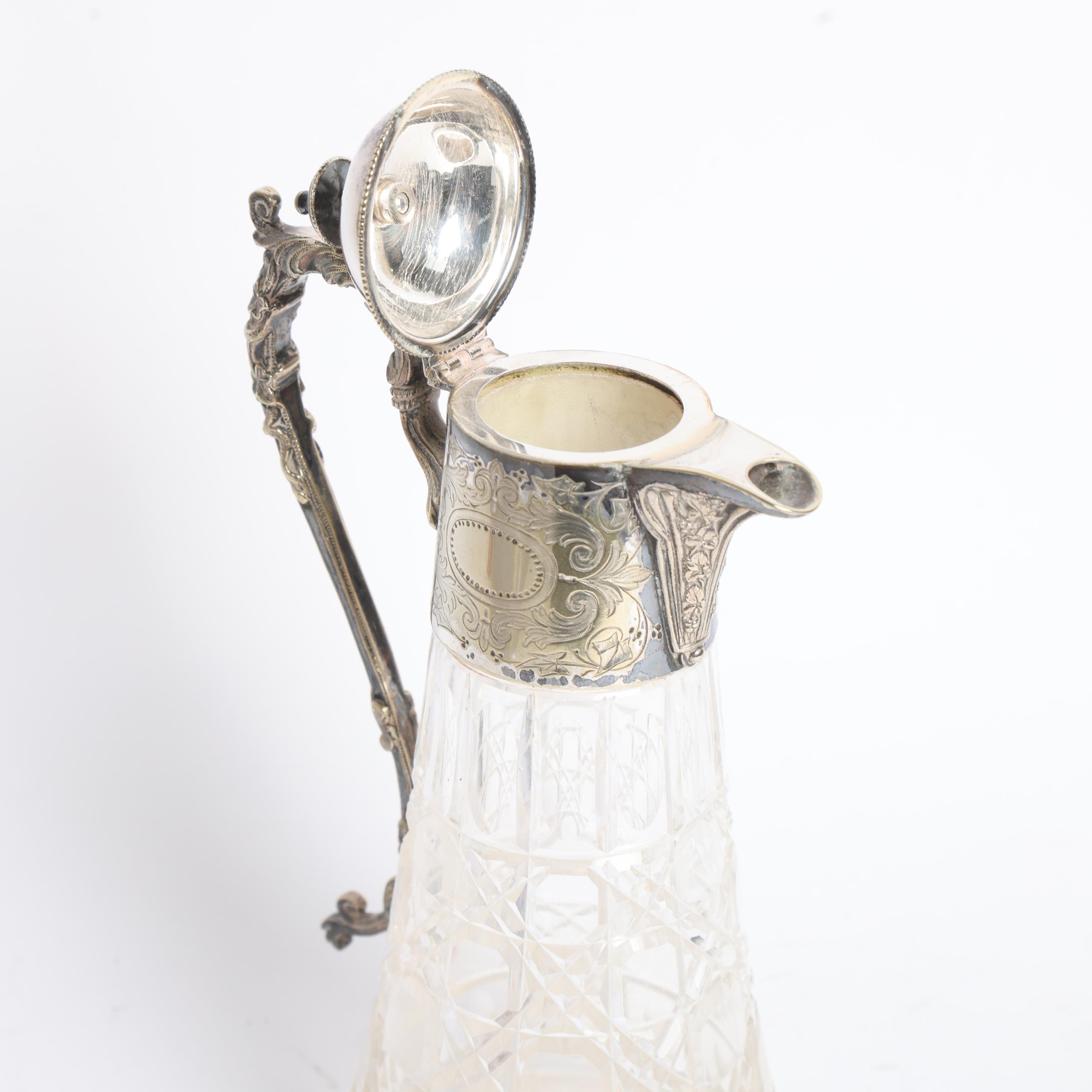 A 20th century moulded glass Claret jug, with engraved silver plated mounts, H28cm - Image 2 of 2