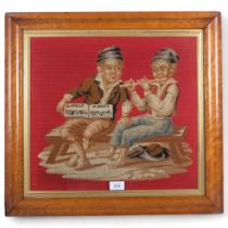 A pair of Victorian maple-framed cross-stitch pictures, boys playing cards, and 2 musicians, 51cm