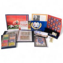 An album of banknotes, including a white five pound note, an album of telephone cards, Regimental