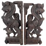 A pair of Eastern stained wood carvings of mythical beasts (Simha Vyala), H44cm