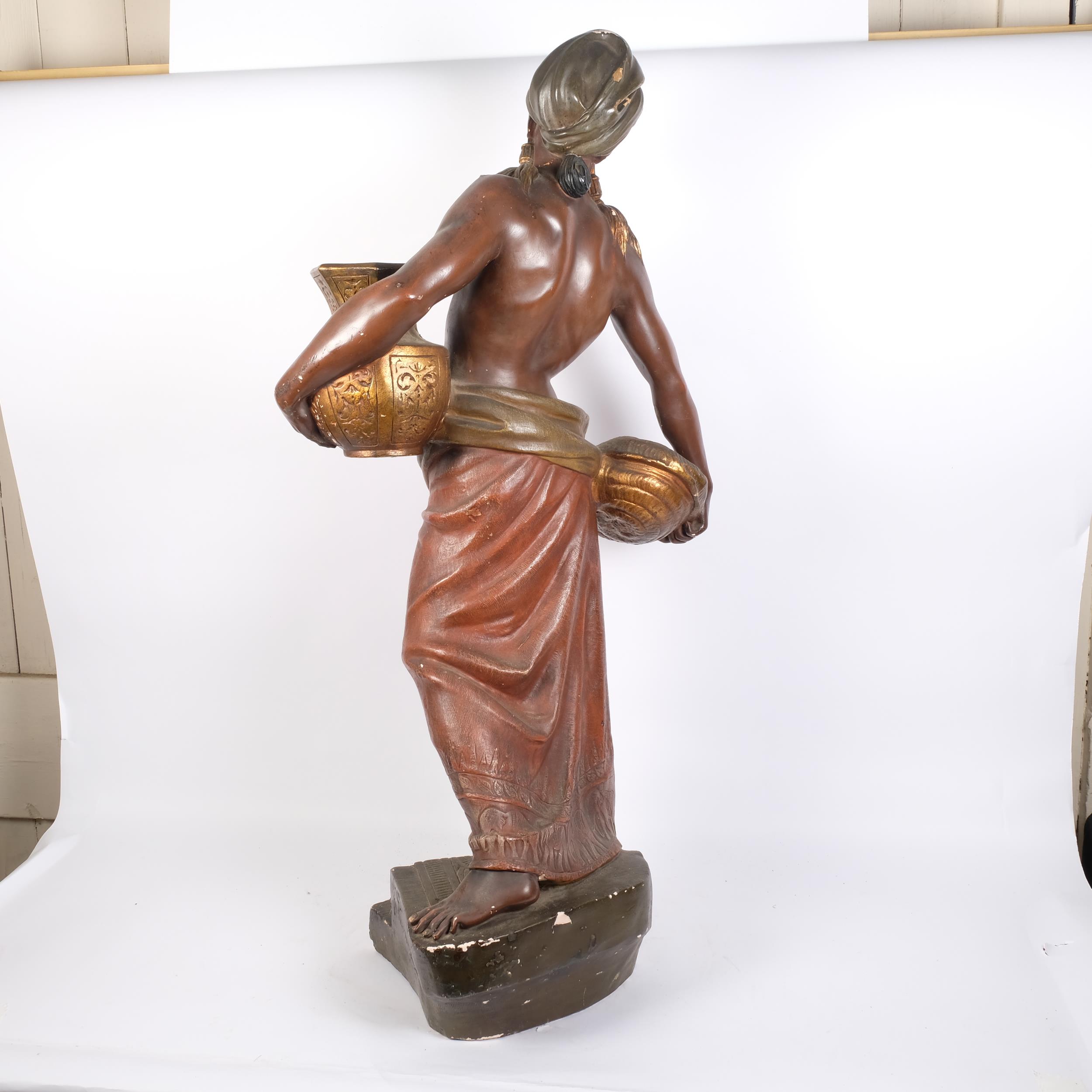 An Antique painted plaster figure of a Blackamoor, stood on a stepped plinth base, signed F - Image 2 of 2