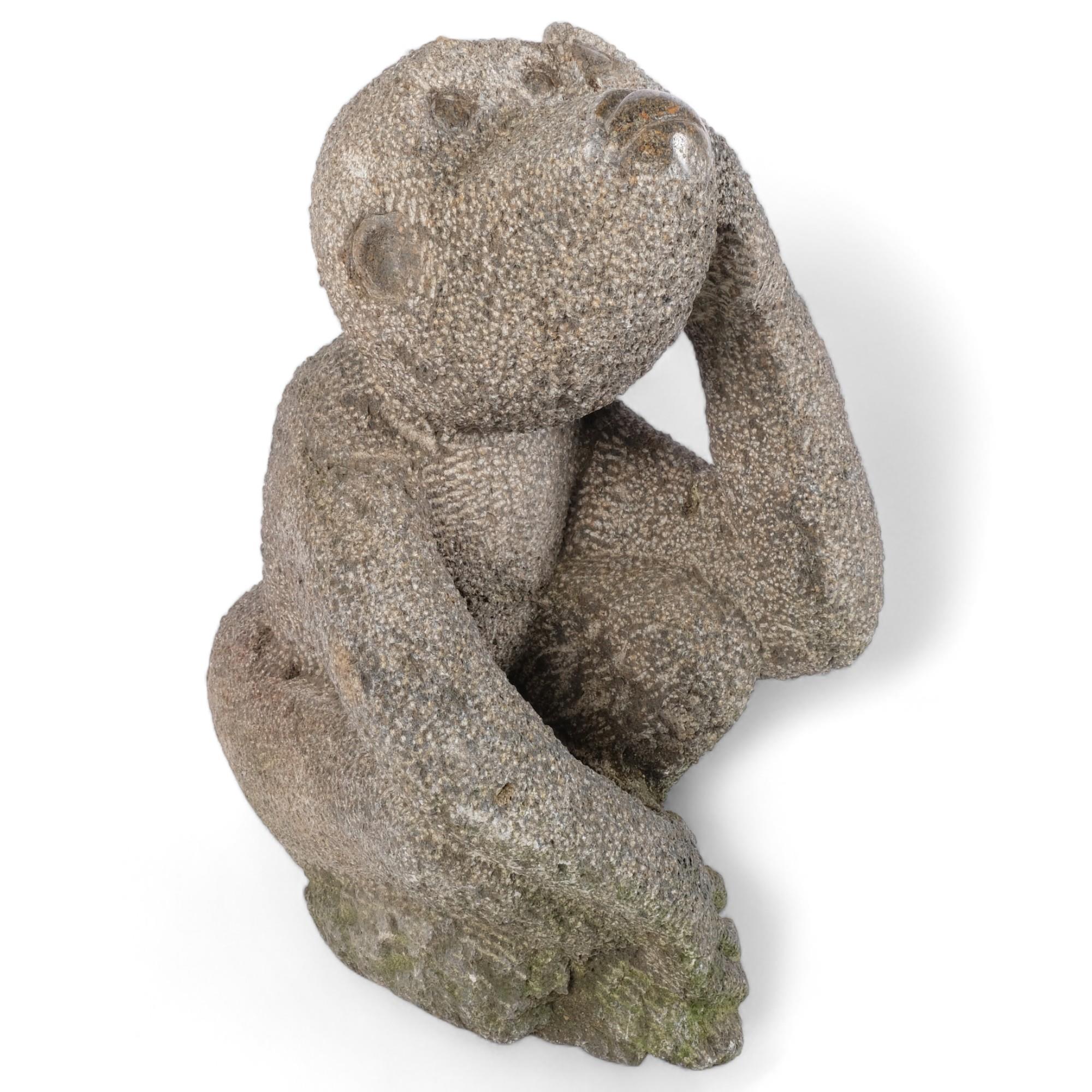 A large hand carved stone study of a monkey, H46cm