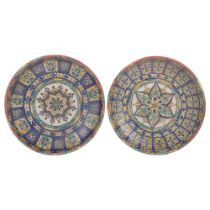 2 Iznik wall-hanging painted dishes, with symmetrical designs, 30cm