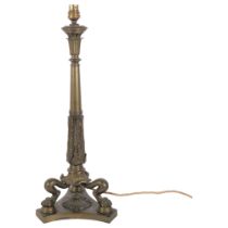 A heavy cast-brass table lamp, on 3 paw feet and triform base, height not including fitting 50cm