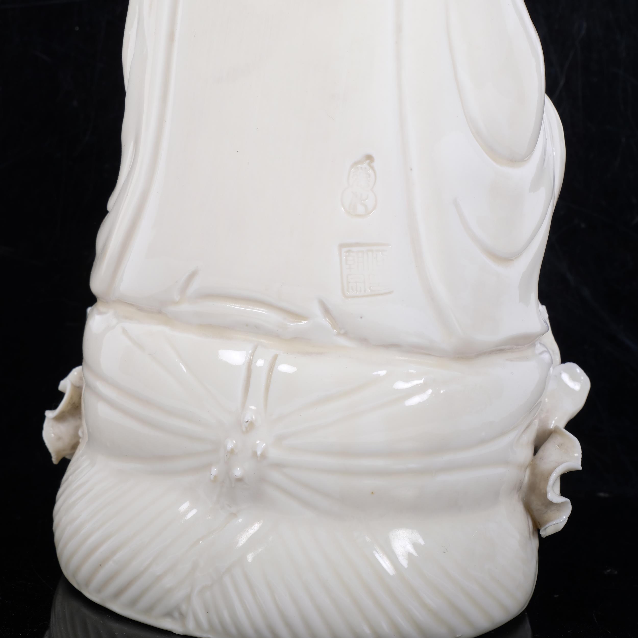 A Chinese porcelain figure of Guanyin sitting on a lotus leaf, H27cm Good overall condition, a few - Image 2 of 2