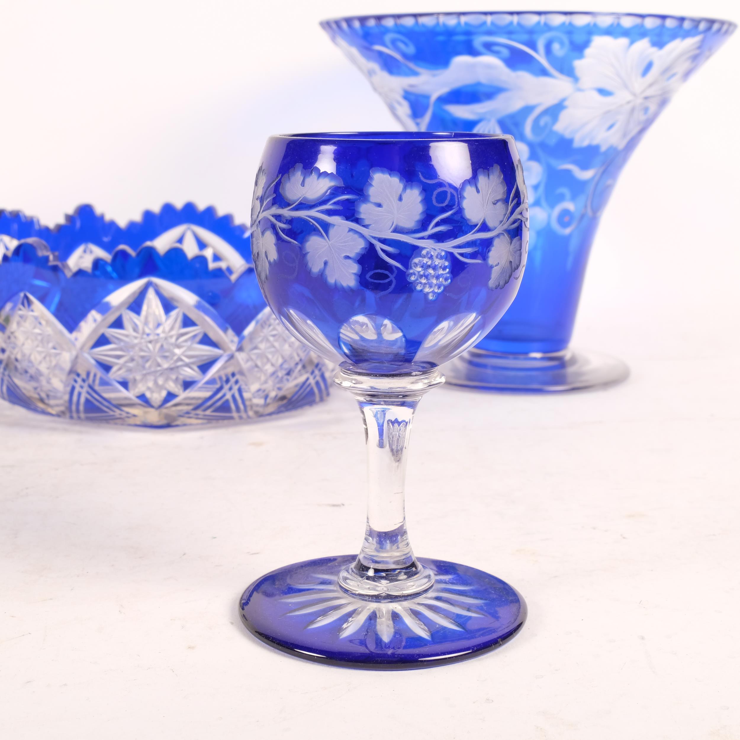 A blue overlay glass vase with grapevine design, H17.5cm, a blue overlay cut-crystal bowl, and - Image 2 of 2