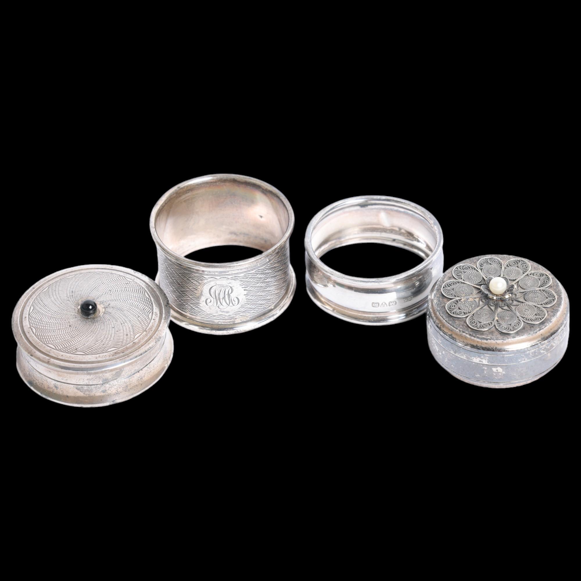 2 modern silver circular pillboxes and covers, and 2 silver napkin rings