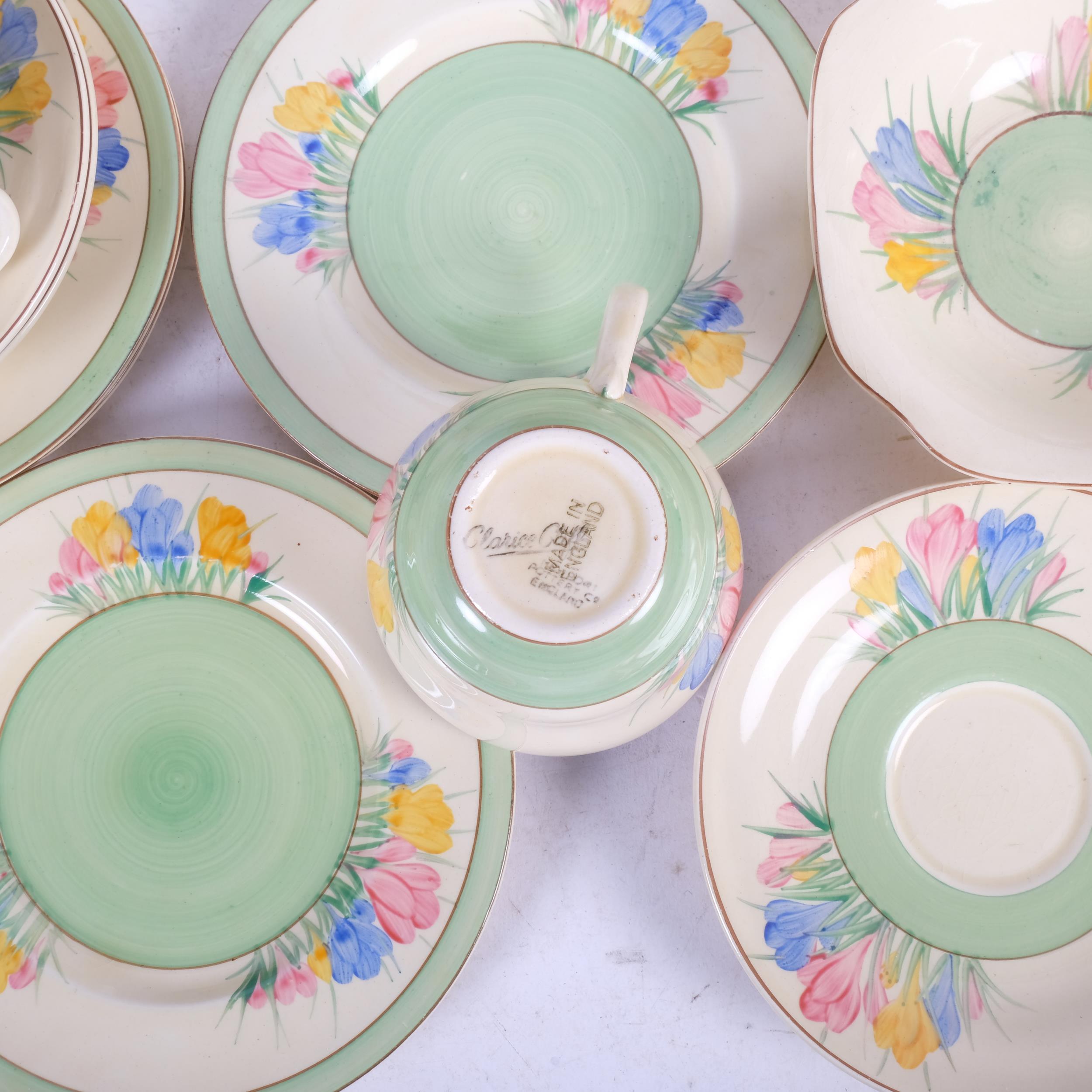 A Clarice Cliff Crocus pattern tea set, comprising 4 cups, 3 saucers, 5 plates, jug and bowl, and - Image 2 of 2