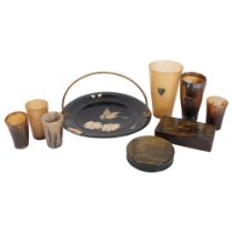 A group of 6 horn beakers, 2 with silver mounts, a cigarette tin with printed decoration, a Georgian