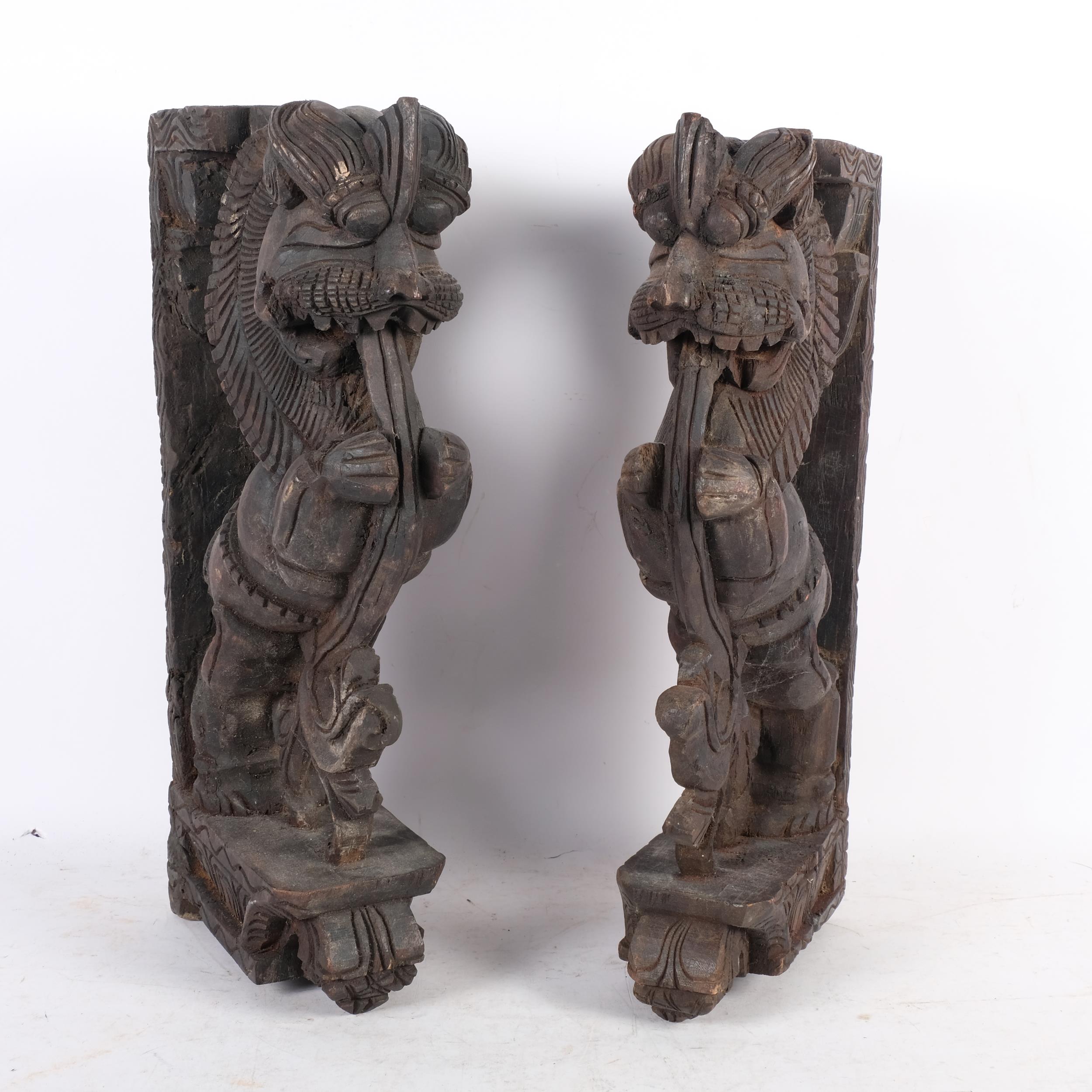 A pair of Eastern stained wood carvings of mythical beasts (Simha Vyala), H44cm - Image 2 of 2