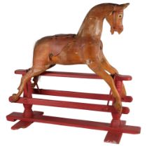 A Vintage pine rocking horse on painted red stand, 96cm x 82cm x 36cm